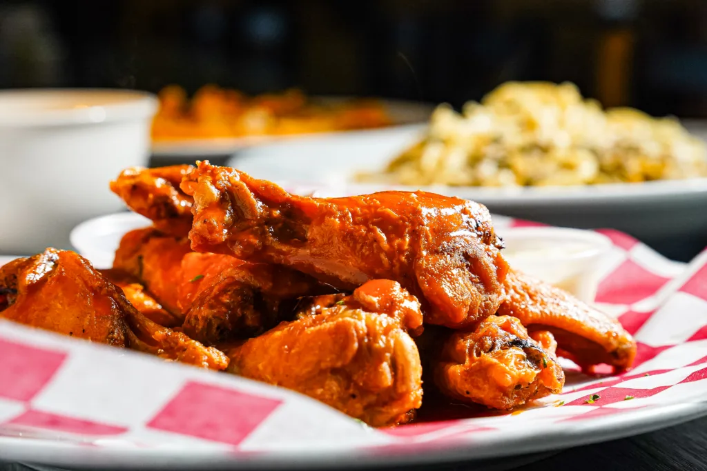 Sauced chicken wings served in a basket